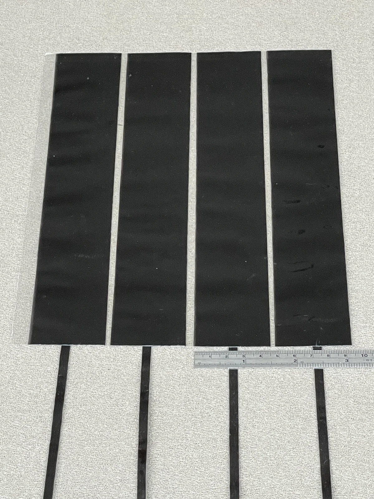 A 12K carbon tow spread from a 5mm bundle into a 40mm-wide ribbon