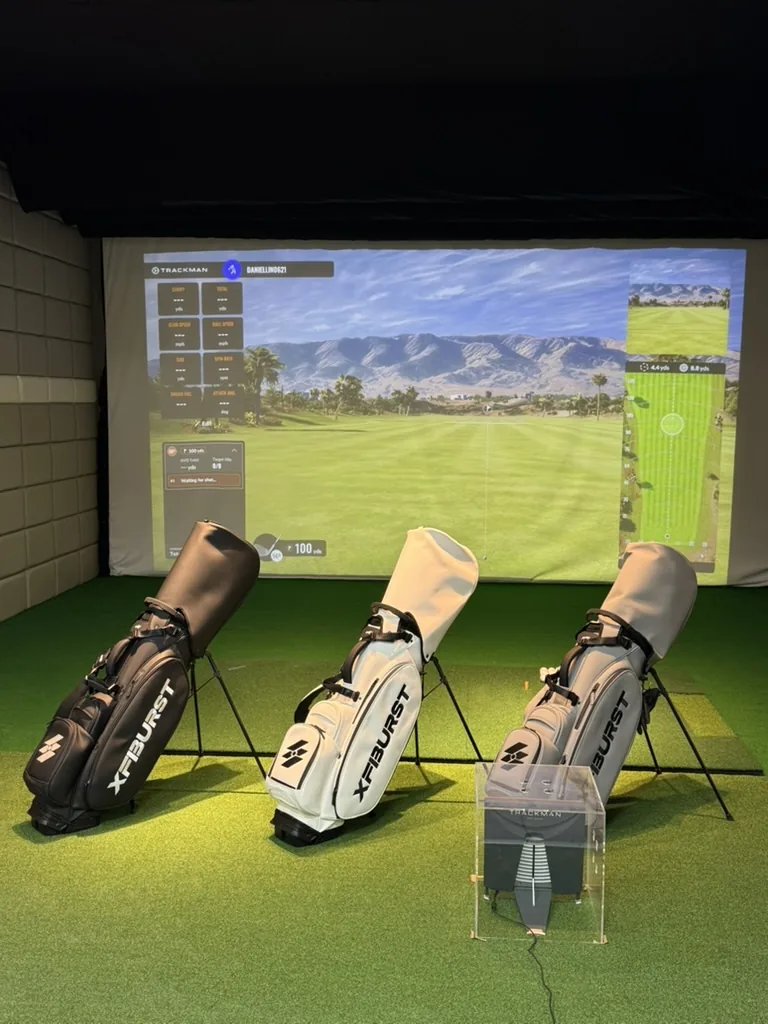 XFIBURST player testing in a TrackMan simulator bay